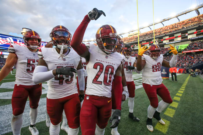 Washington Commanders cornerback Jartavius Martin (20) celebrates after an interception during the second half against the New England Patriots at Gillette Stadium.